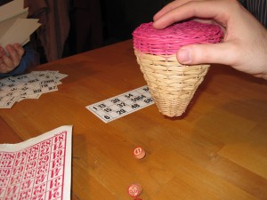 For Tombola, the number chips to be called are shaken out of the wicker holder